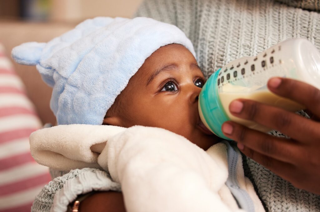 Infant being fed milk